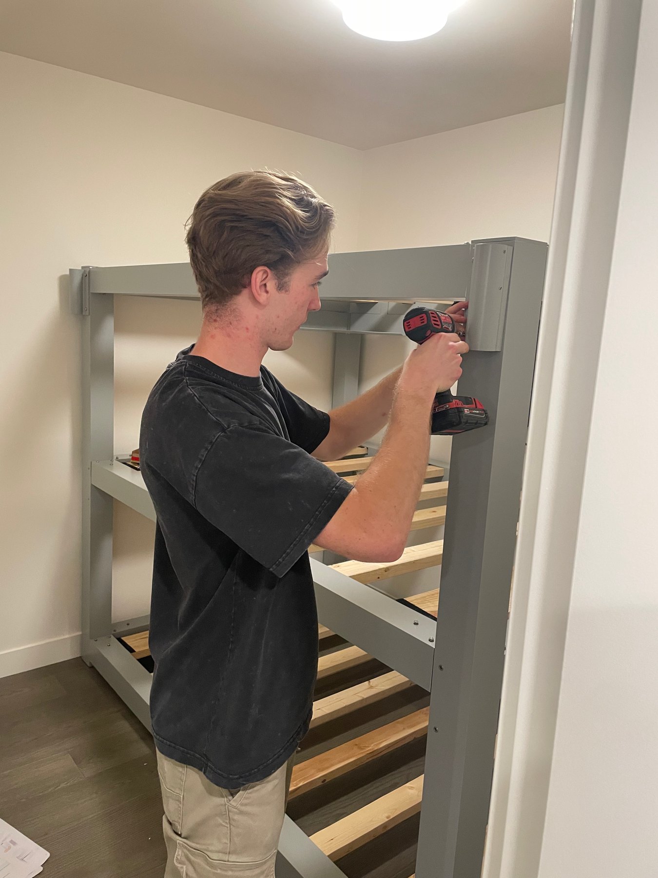 Jamie Hatch assembling a bunk bed for an Apex Assembly customer